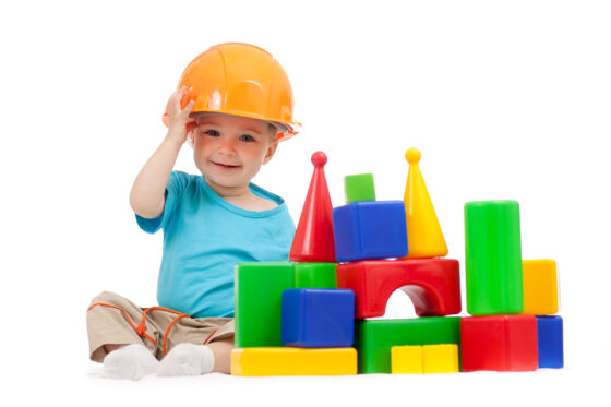 Humor in Customer Experience - Smiling child in hard hat